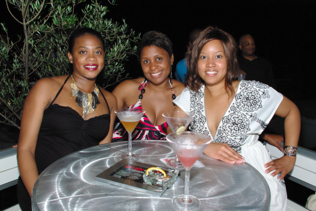 African-American women posing a an Atlanta rooftop event