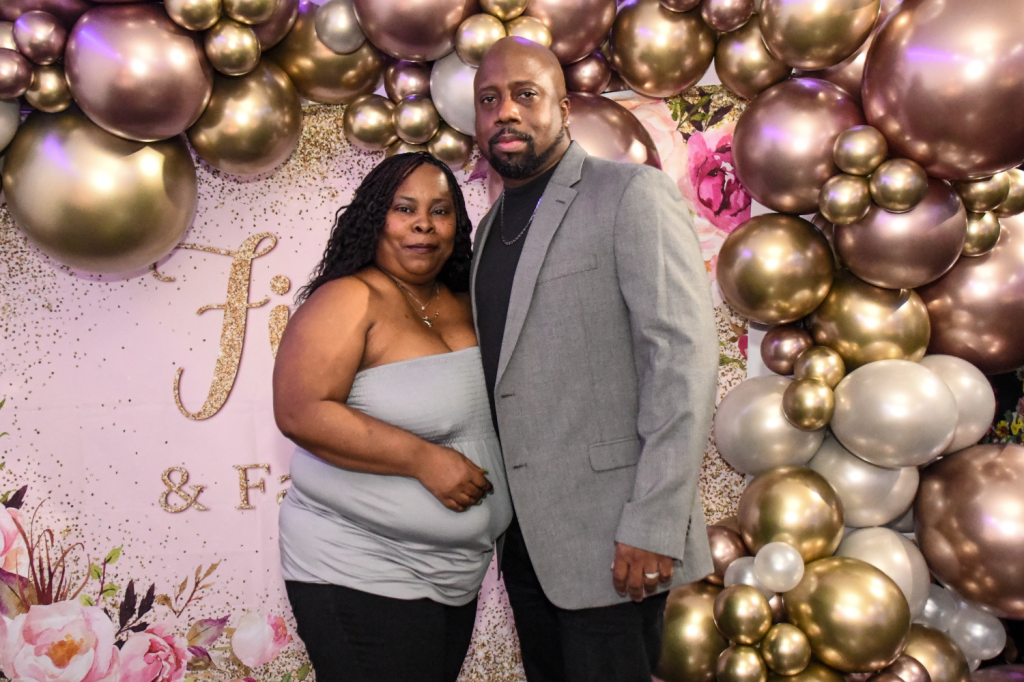 African-American couple poses at 50th birthday party