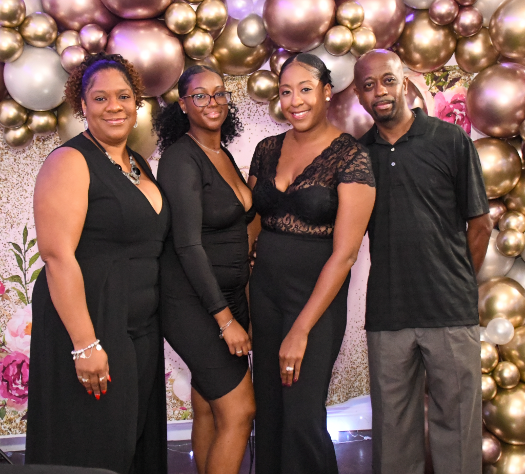 African-American family poses at 50th birthday party