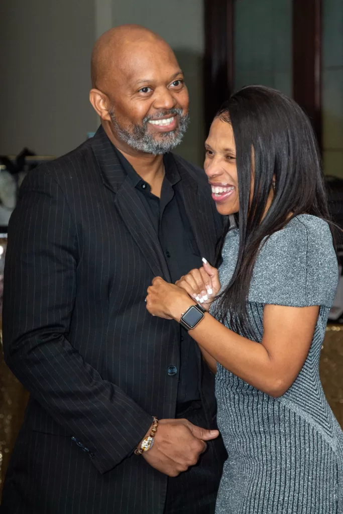 African-American couple smiling at a party