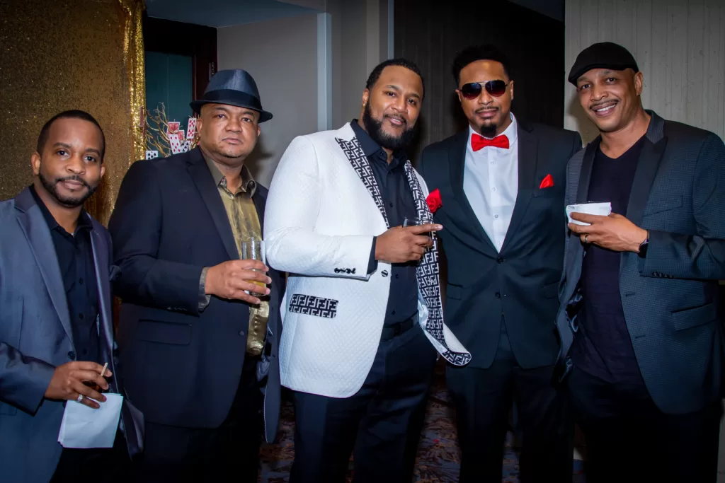 African-American men posing with drinks